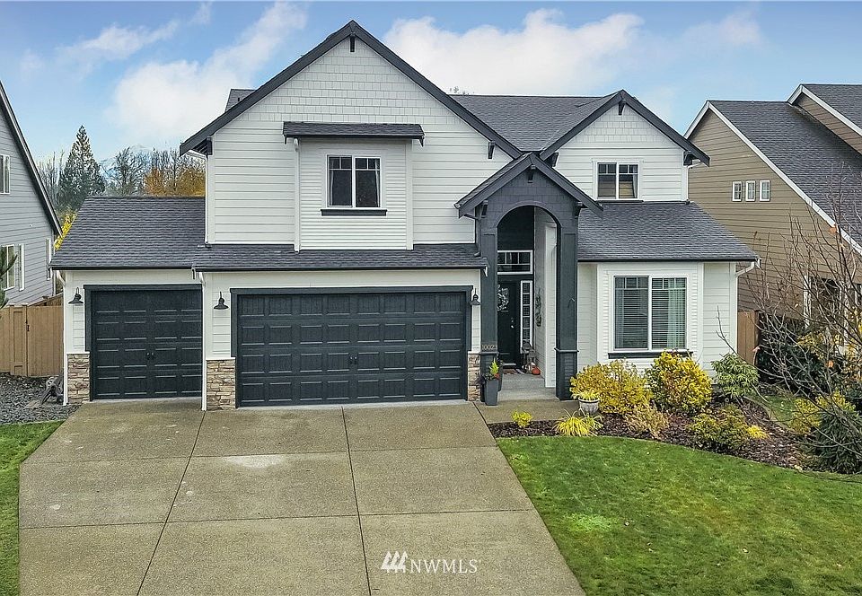 Front view of home, note 3 car garage and large driveway. 