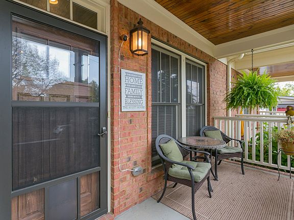 The covered porch is the perfect spot to unwind after a busy day! Take a moment to appreciate the peaceful, friendly neighborhoo