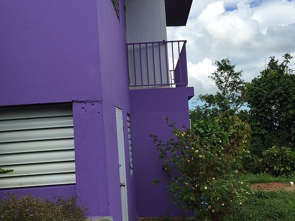 back of house with balcony