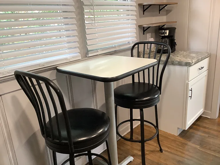 Eat in kitchen with coffee bar, additional dining in living room.