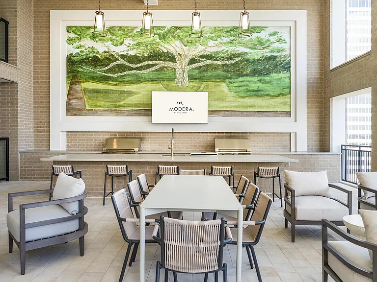 Fire up the flavor at Modera Waugh's covered grilling area!