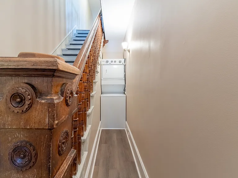 Laundry is located next to the stairs. Full sized washer and dryer.