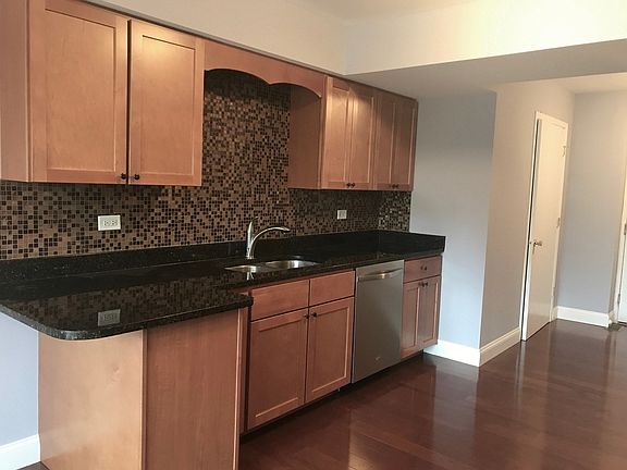 Loads of Maple Cabinetry sleek Granite countertops.