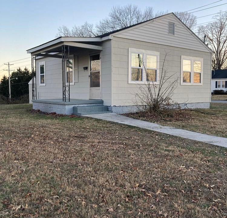 Front sidewalk and covered porch