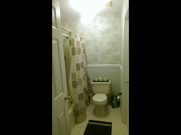 Bathtub and toilet with jack and jill configuration.