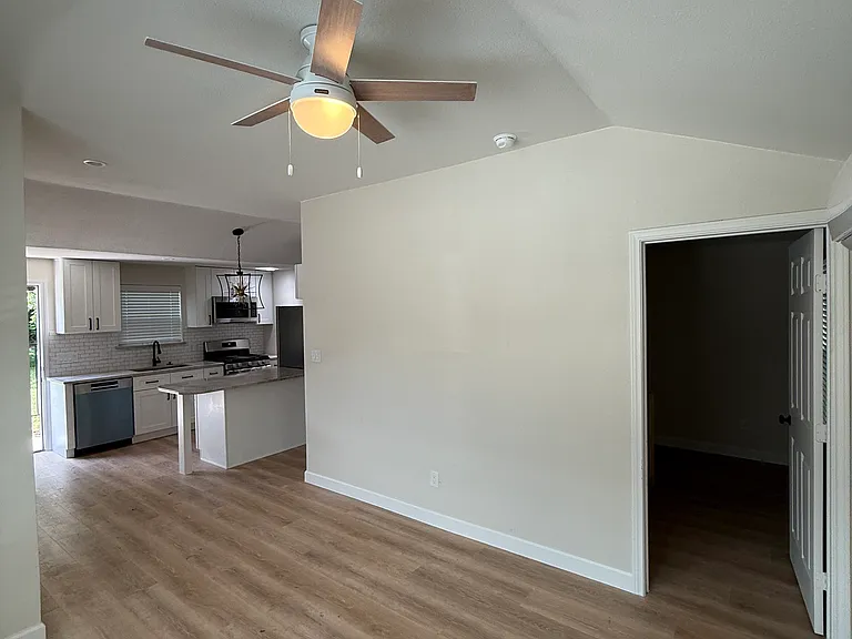 Living room has vaulted ceilings