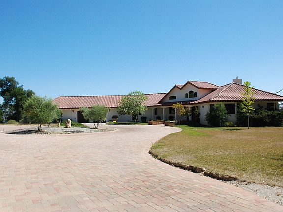 The approach & circular driveway in front of home
