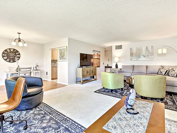 View of Dining Area, door to kitchen and hallway to remainder of the unit