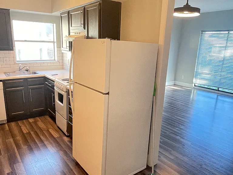 View of kitchen and main living/sleeping area from the dedicated dining area.
