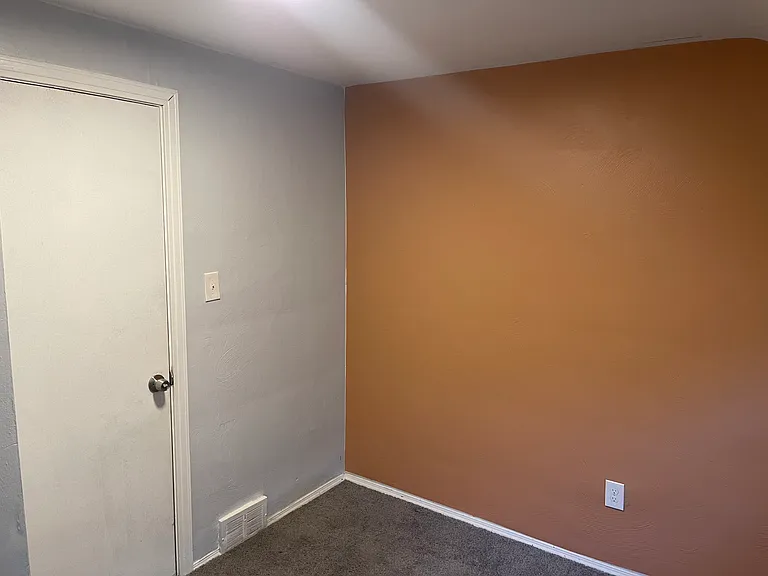 3rd bedroom - warm accent wall, good lighting