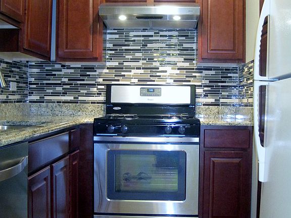 Updated kitchen with granite counters and stainless applianc