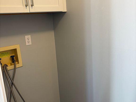 laundry hook-ups; Cabinets in laundry room