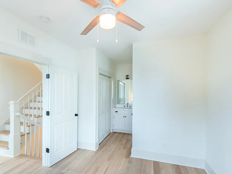 First bedroom has a private closet in the doors on the left side, and bathroom on the right.