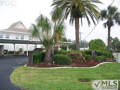 Front area of the condo community, nicely landscaped with concrete curbing, etc.