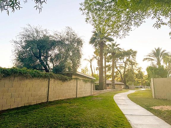 Greenbelt & walkway on side of home.