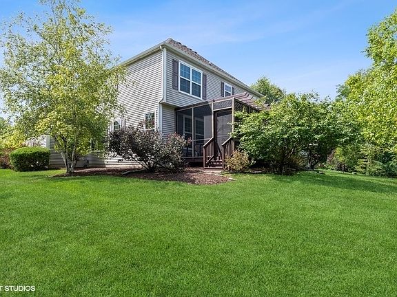 Back of the house with the Screened in Pergola Porch
