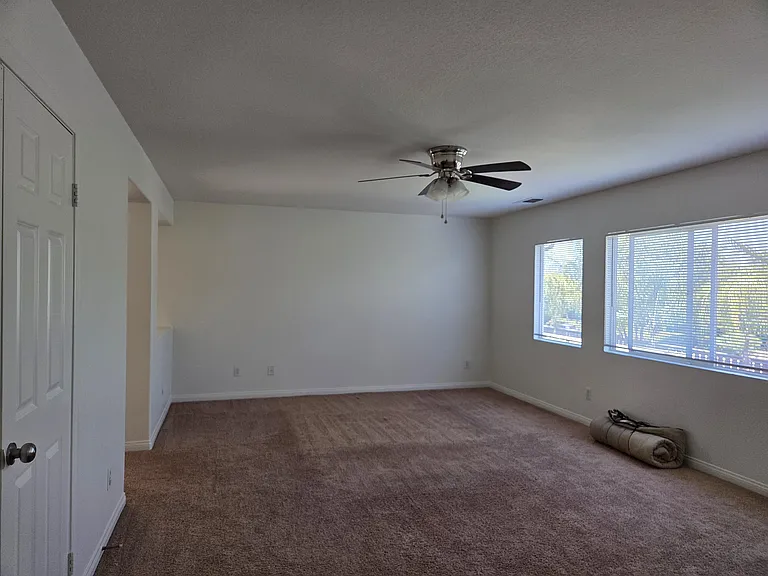 Master Bedrooms with ceiling fan and a loft with fireplace