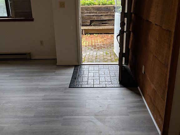 Entryway/front door leading to private patio. Living room is to left of photo; photo included for size/perspective.