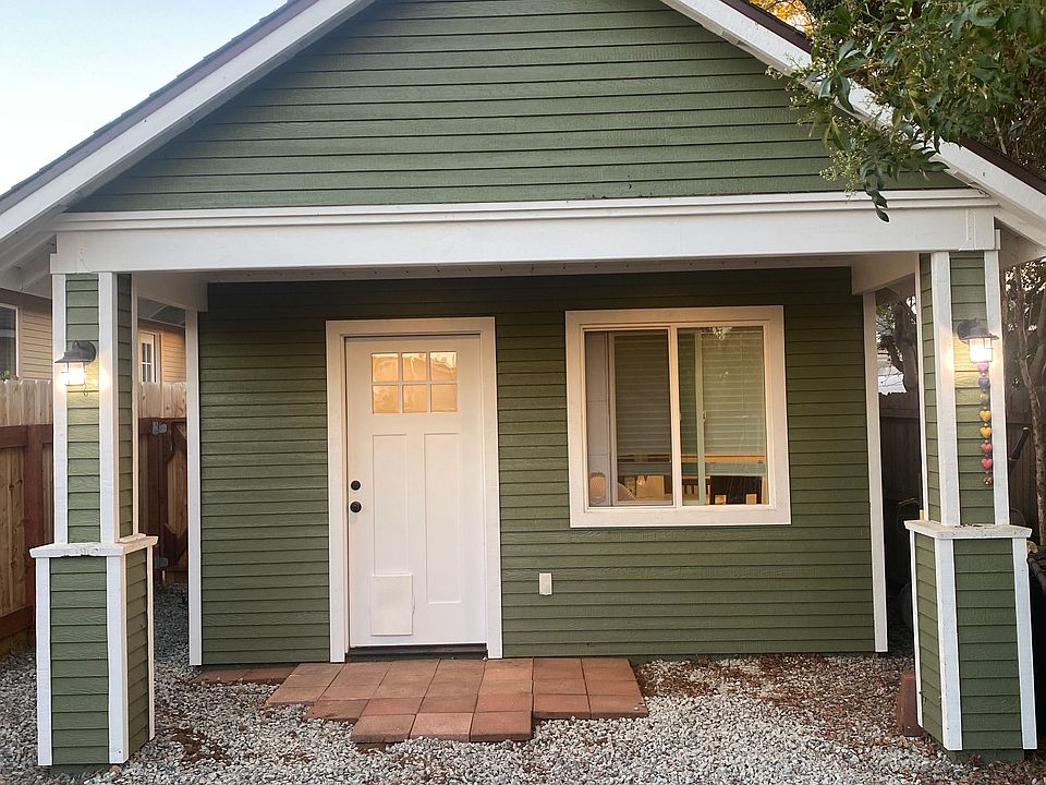 Back porch that leads into a private fenced yard.