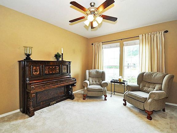 Formal Living with large window and great walls to display works of art or family portraits!