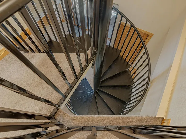 Spiral stairs to loft.