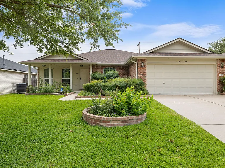 Landscaped front yard, with an automatic sprinkler system and front porch