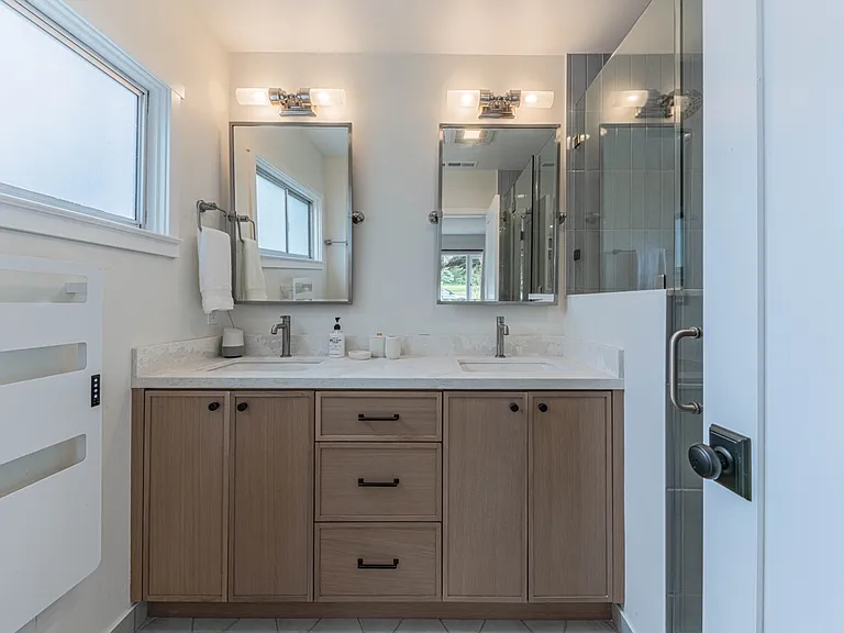 Primary Bathroom with 2 sinks, towel heater and shower