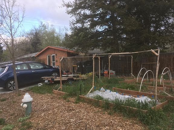 Front yard features 6 large garden boxes ready for your summer and fall harvest!