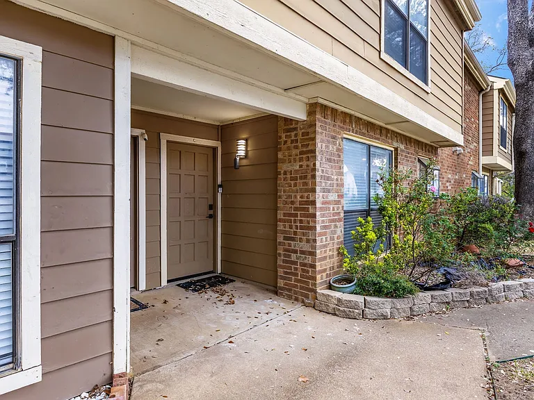 Property entrance with a patio area