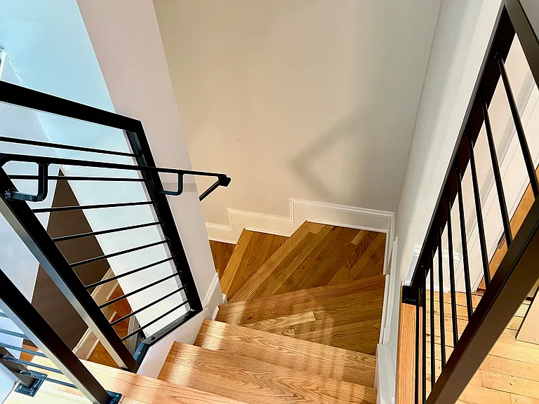 Stairs from living level to bedroom level.