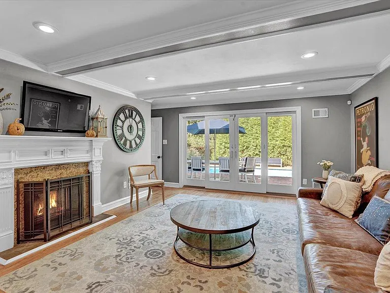 Family Room, coffered ceiling, direct access to pool