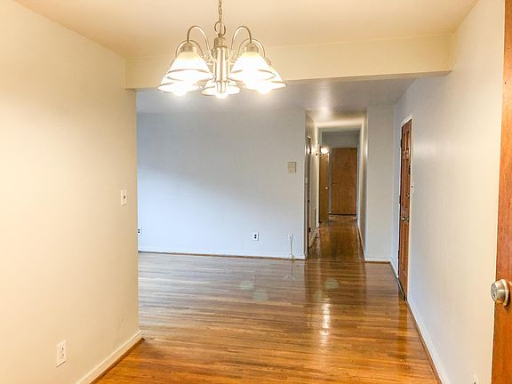 Open floor plan Dining & Living, leading to hallway