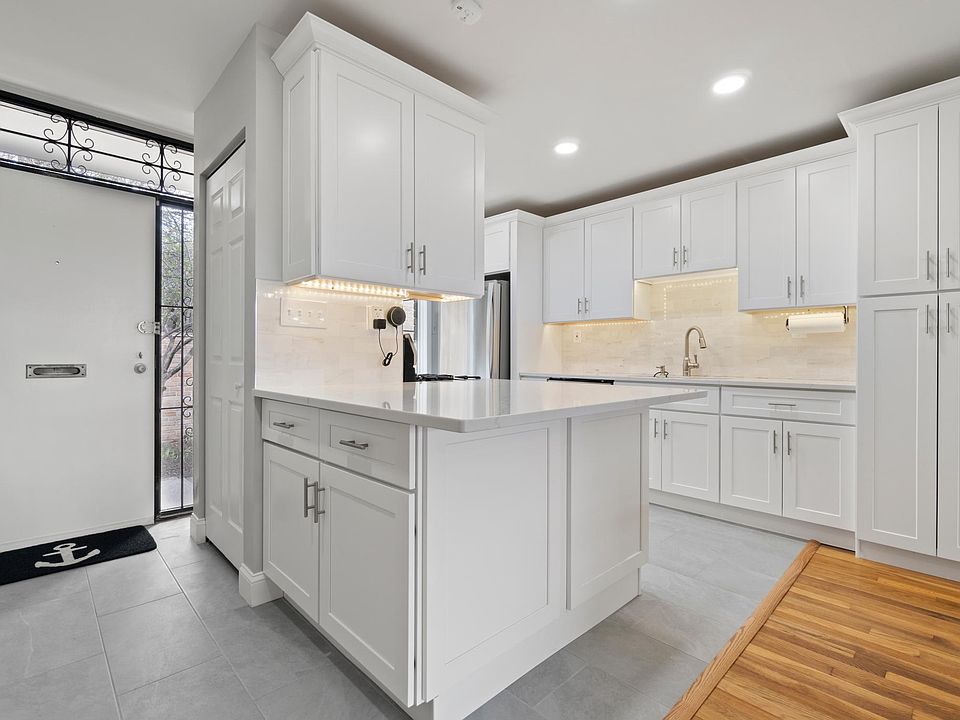The front door and the brand new kitchen