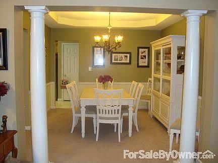 Formal Dining
						:
						Formal dining room with trey ceiling, custom lighting, pillars and chair rail
