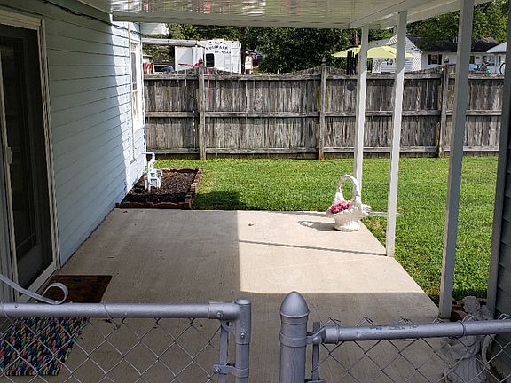 Covered patio rear entrance.