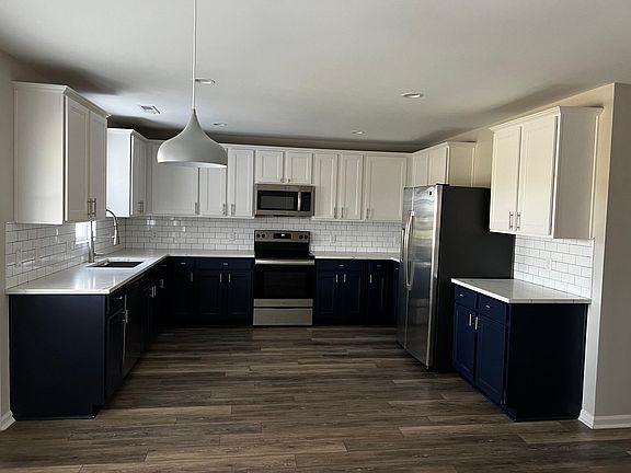 Beautifully renovated kitchen.New appliances. New floors. New backsplash.