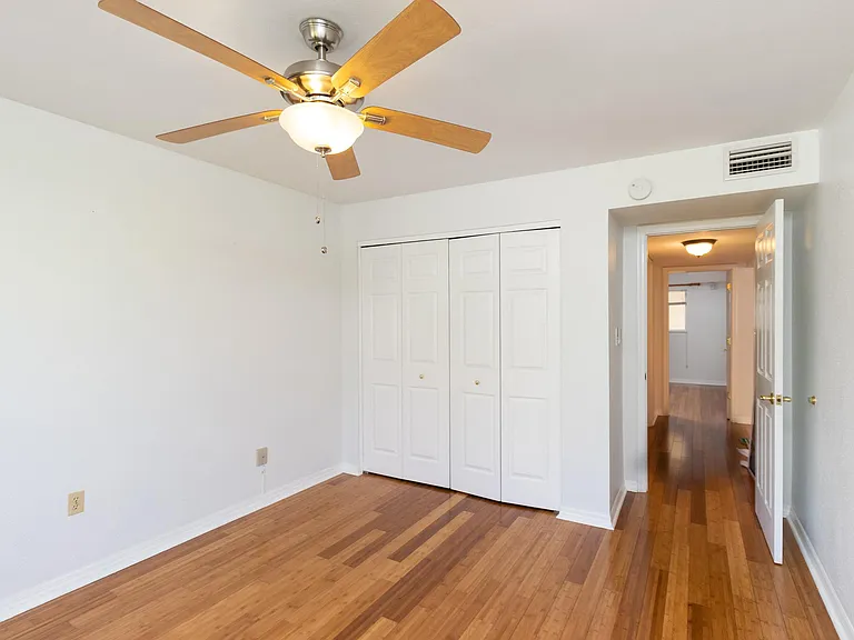 Primary bedroom with closet system.