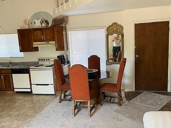 Dining table & kitchen area.
