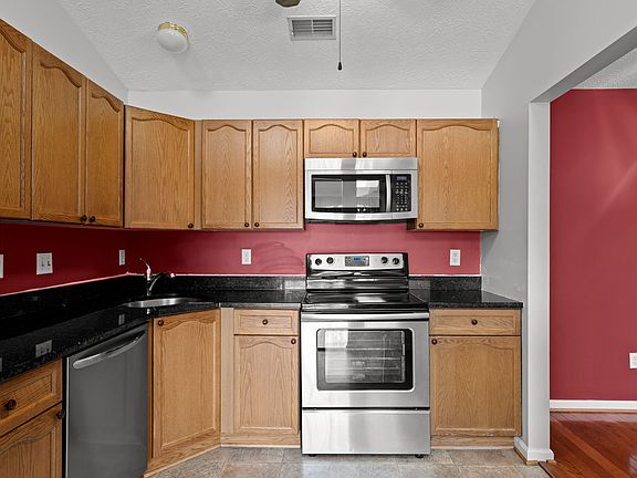 Brand new stove and no more maroon paint