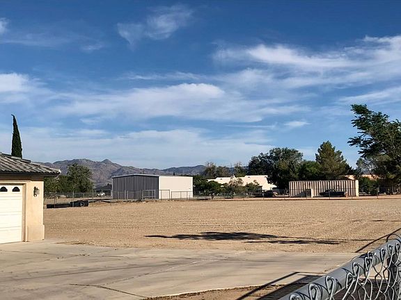 over one acre flat lot for kids play on or for more parking spaces