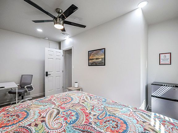 Full bed, desk, chair, mini-fridge, nightstand, lamp, reach-in closet