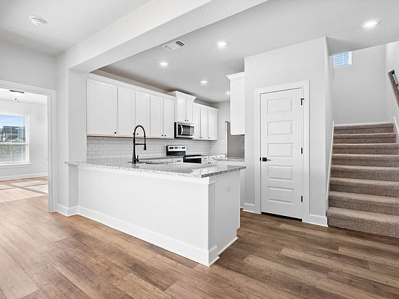 The kitchen has a wonderful breakfast bar.
