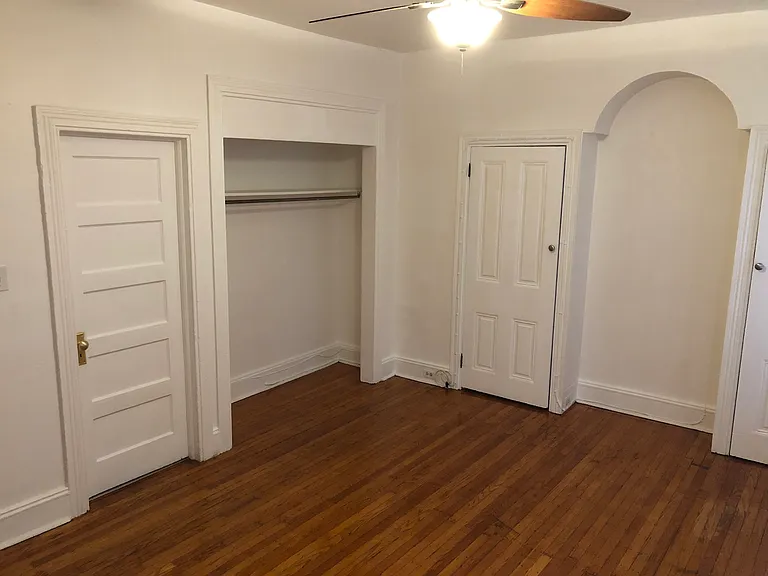 large spacious bedroom with two closets