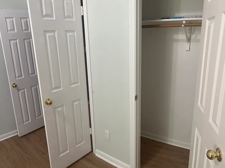 Shows closet and double door entrance into this main floor bedroom.