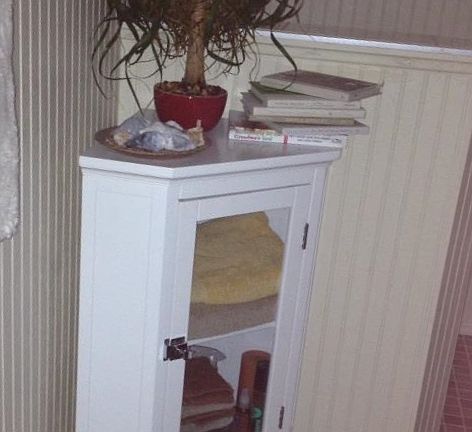 Privacy wall with marble tile shelf.