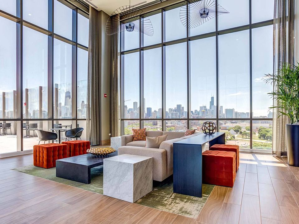 Soak in breathtaking city views from the rooftop lounge, featuring towering windows that offer an expansive, unobstructed view of the skyline.