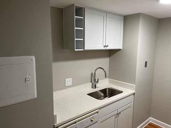 New Kitchen with new cabinets, faucet, sink and garbage disposal.