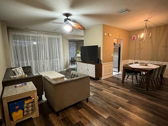 Living room and formal dining room before new paint
