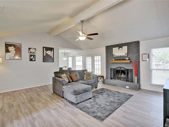 Family room with fire place and wall of windows