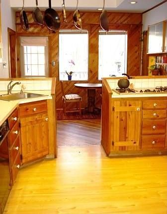 Spacious central kitchen adjacent to dining room and dine-out deck.